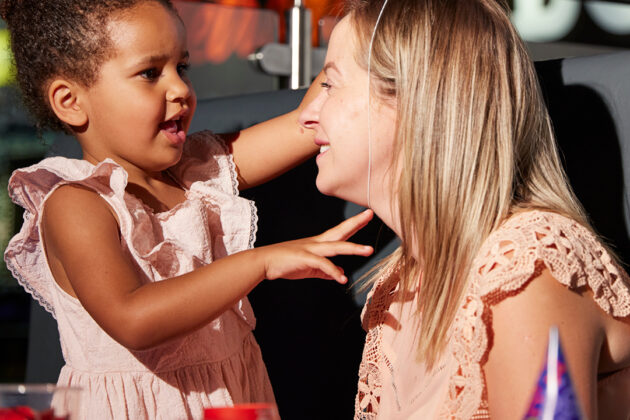 Woman and girl at a party