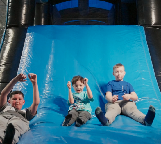 Kids going down a slide